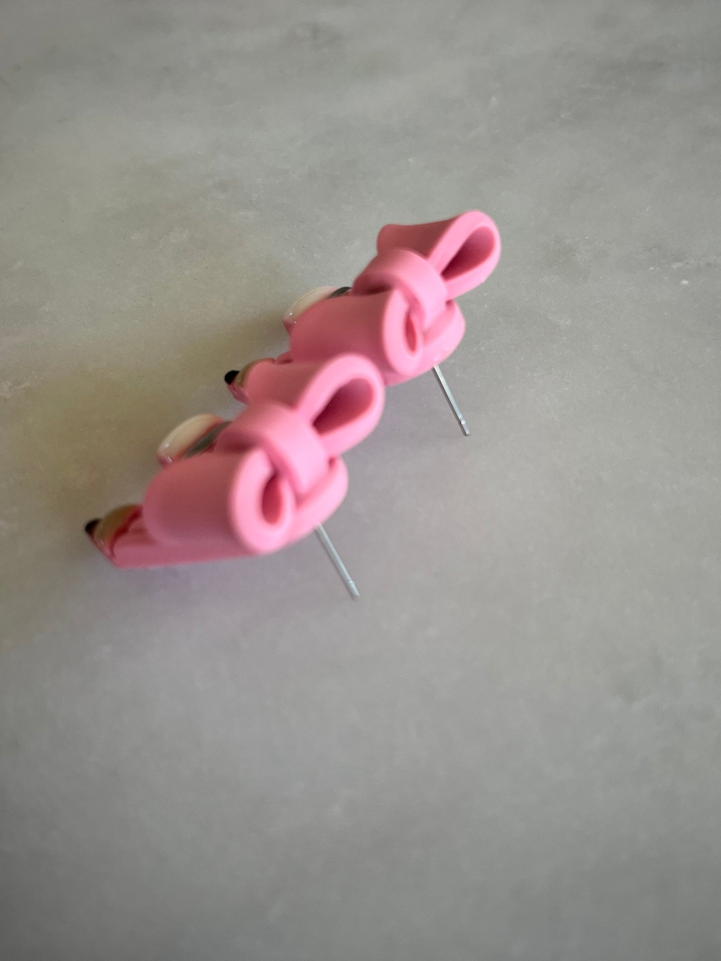 Pink pencil bow studs