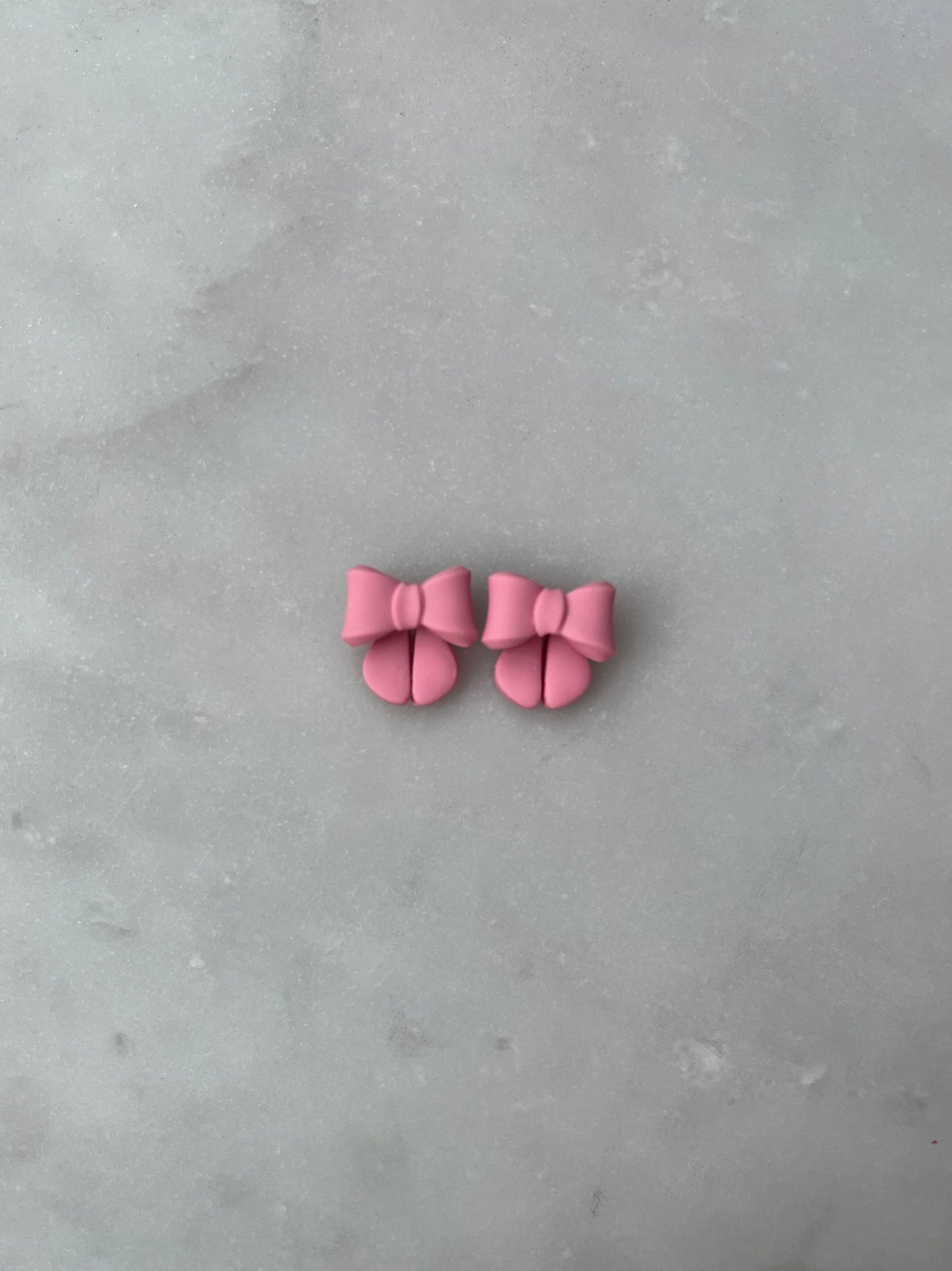 Pink bow studs