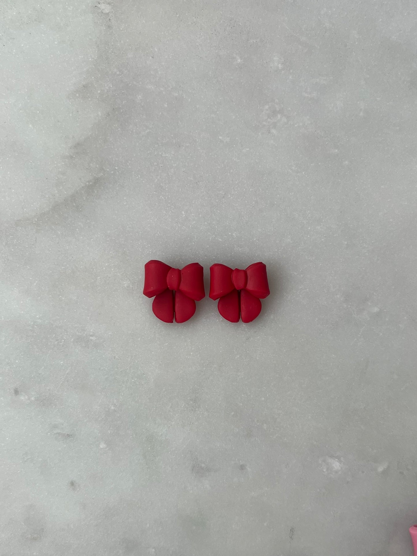 Red bow studs